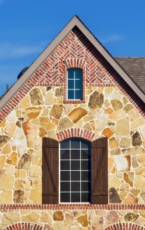 Window and roof top of a southern homeの写真素材
