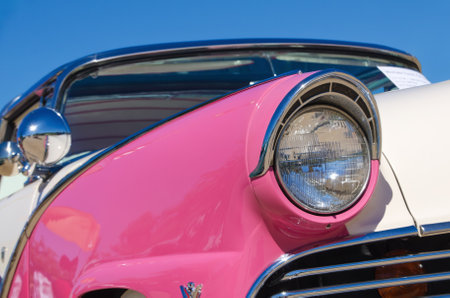 Westlake, Texas - October 19, 2013 - A 1955 Ford Crown Victoria 2dr hardtop is on display at the 3rd Annual Westlake Classic Car Show in Westlake, Texas  Closeup of headllight detailsのeditorial素材