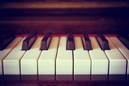 Piano keyboard closeup with shallow depth of field. Vintage filter effects.の写真素材