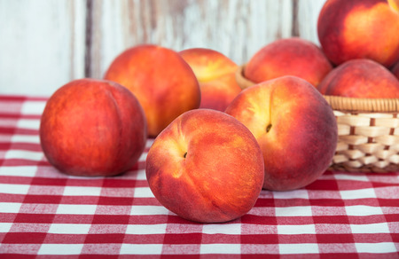 Closeup of fresh peach fruits on tableの写真素材