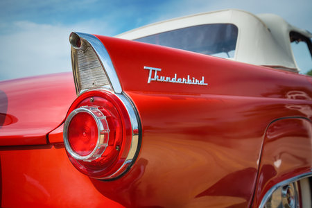 WESTLAKE, TEXAS - OCTOBER 17, 2015: Tail fin and taillight details of a red 1956 Ford Thunderbird Convertible classic car.