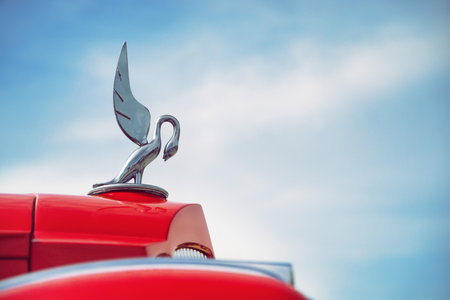 WESTLAKE, TEXAS - OCTOBER 17, 2015: Hood ornament of a red 1936 Packard Model 1404 classic car against blue sky.のeditorial素材