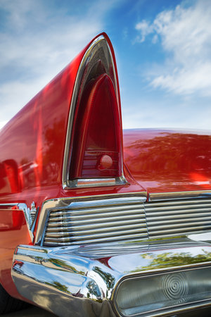 WESTLAKE, TEXAS - OCTOBER 17, 2015: Tail fin and taillight details of a red 1957 Lincoln Premiere classic car.のeditorial素材