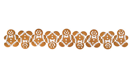A row of Gingerbread Men cookies isolated on white background border の写真素材