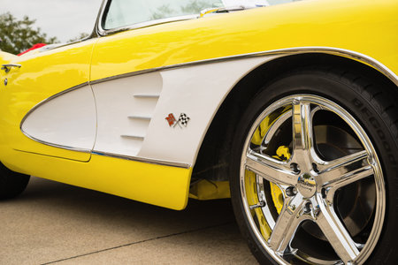 Westlake, Texas - October 21, 2017: A front wheel and side details of a yellow 1958 Corvette Chevrolet classic car. Closeup.のeditorial素材