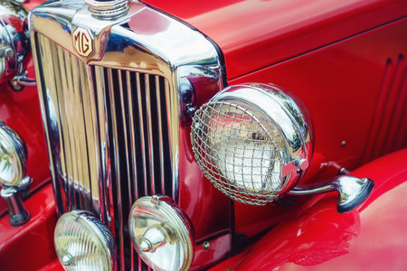 Westlake, Texas - October 21, 2017: Closeup of headlights and the grille of a red 1951 MG TD classic car.のeditorial素材