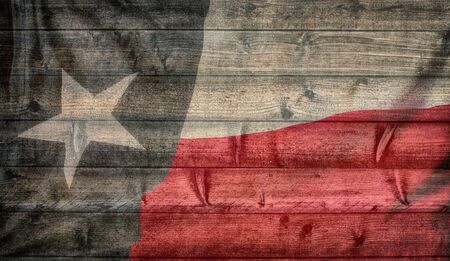 Texas state flag pattern on wooden board texture. Vintage style weathered background.の写真素材