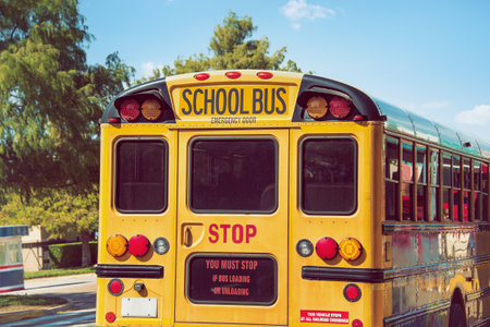 Rear view of a yellow school bus. Back to school concept.の写真素材