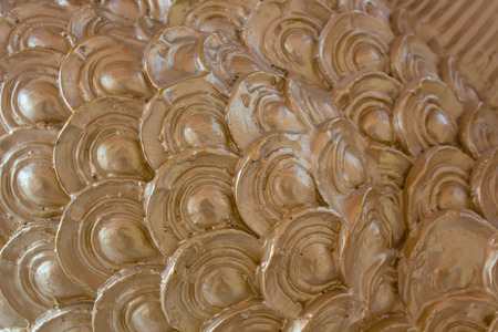 Beautiful golden cement wall, look like fishの写真素材