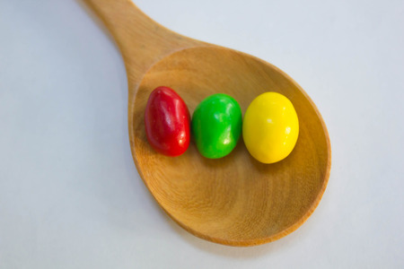 Colorful of Chocolate ball on wooden spoonの写真素材