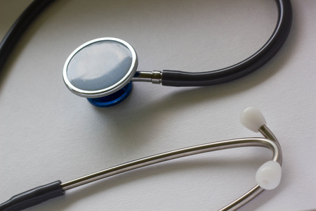 Stethoscope on white paper backgroundの写真素材
