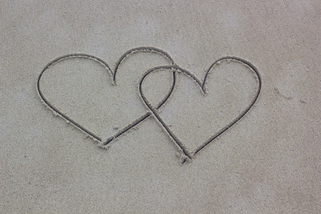 Heart shaped on sand, two heart shaped on the beachの写真素材