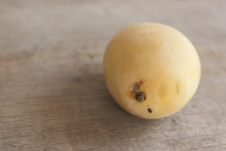 Ripe mango on wooden tableの写真素材