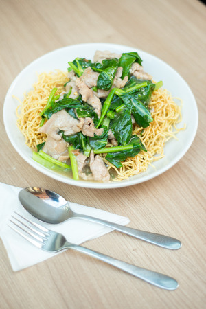 Crispy fried noodle with pork soaked in gravyの写真素材