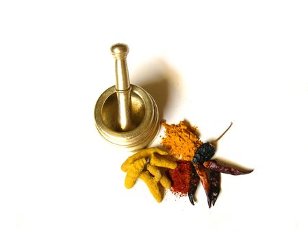 Chilies and Turmeric- Whole and Powdered with Mortar          の写真素材