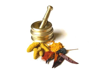 Chilies and Turmeric- Whole and Powdered with Mortar          の写真素材