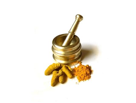 Bright Yellow Turmeric- Whole and Powder with Mortar          の写真素材