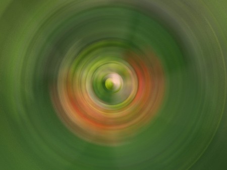 Concentric green orange circular pattern depicting spring.          の写真素材