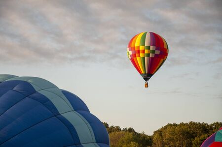 Beautiful Colorful Hot Air Balloon flying in the Tranquil sky - Thirty Fourの写真素材