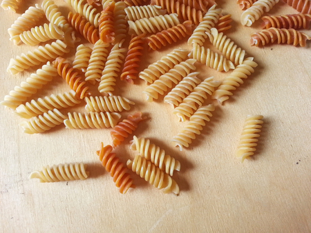 Macaroni on wood texture backgroundの写真素材