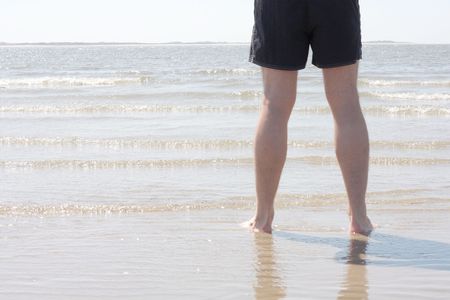 Man standing in the waterの写真素材