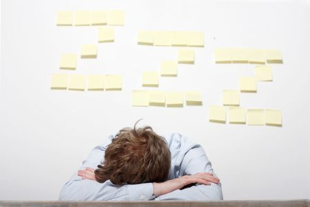 A tired business man sleepingの写真素材
