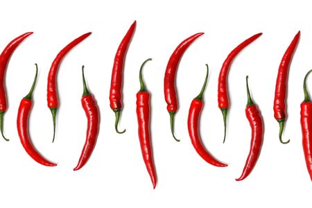 Hot chili peppers isolated on whiteの写真素材