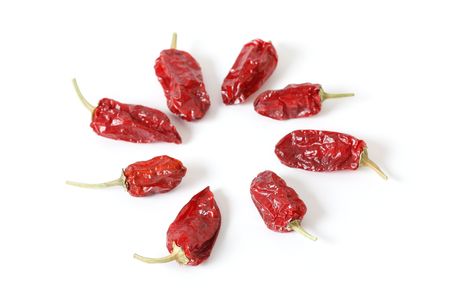 Dried red chili peppers isolatedの写真素材