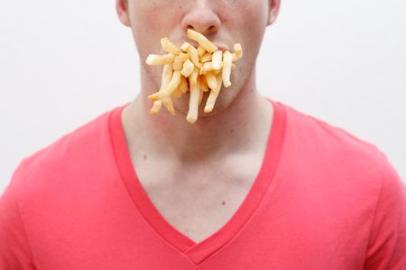 A man full of friesの写真素材