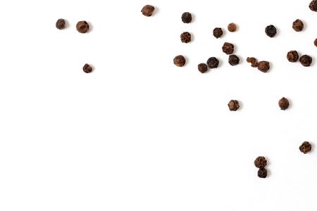 Wholesome peppercorns on a white bgの写真素材