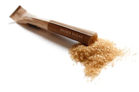 Cane sugar isolated on whiteの写真素材