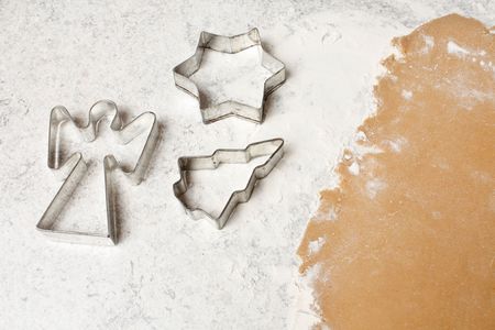 Cookie dough with christmas angles, trees and starsの写真素材