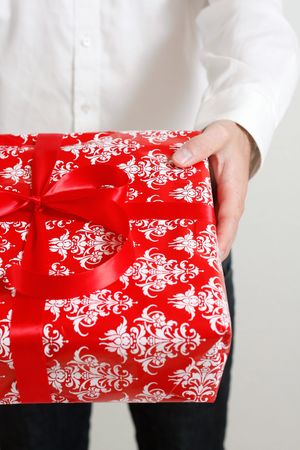 A man presenting a christmas present
