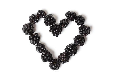 Blackberries in a beautiful heart shapeの写真素材