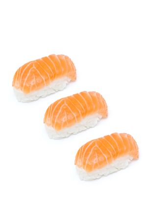 Delicious salmon nigiris isolated on whiteの写真素材