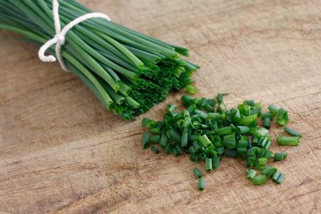 Chives on a wooden surface