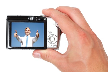 A hand taking digital picturesの写真素材