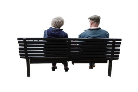 A senior couple sitting on a benchの写真素材