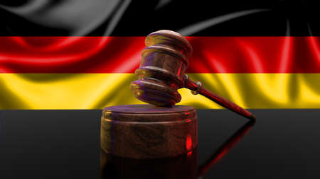 Law of Germany. Wooden gavel and flag of Germany on background - law concept.の写真素材
