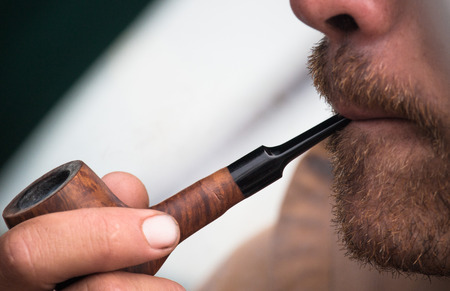 Puffing a pipeの写真素材
