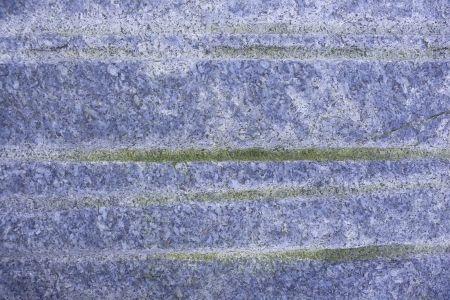 Close-up view of Large Beach Stone with green steaks and blue hueの写真素材