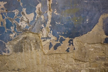 Old Brick wall with cracked plasterの写真素材