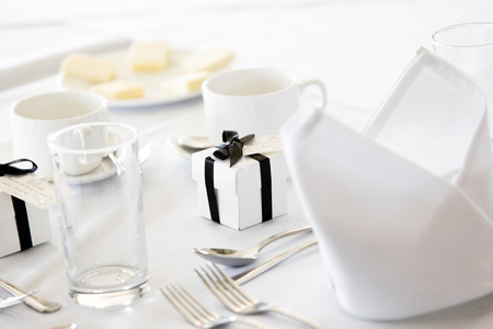 White Wedding Table with Gifts and Cutleryの写真素材