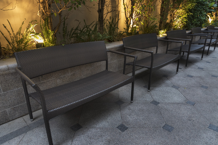 Empty seat in garden at nightの写真素材