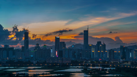 Skyline of Shenzhen City, China at dusk. Viewed from Hong Kong border