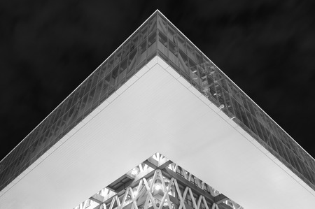 low angle view of modern architecture exterior and sky at nightの写真素材