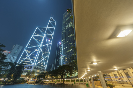 High rise modern office buildings in Hong Kong city at nightの写真素材
