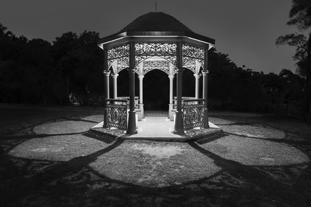 Gazebo in park at nightの写真素材