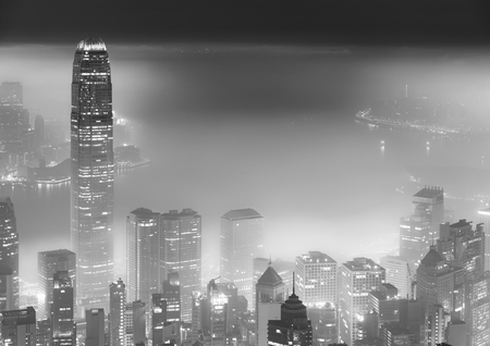 Misty night view of Victoria harbor in Hong Kong cityの写真素材