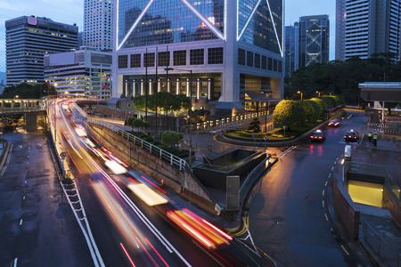 Car Traffic in central district of Hong Kong city at duskの写真素材